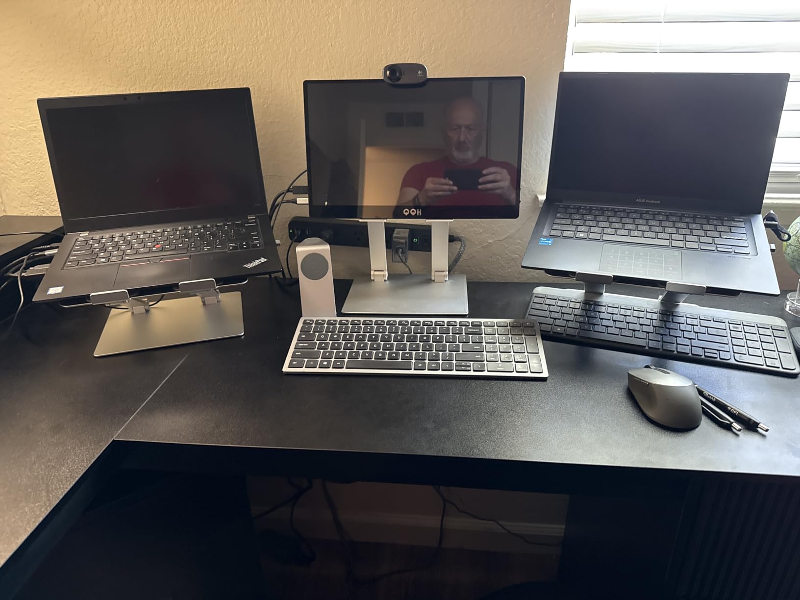 Amazon Basics Sturdy and Portable Ergonomic Laptop Stand for Desk, Height Adjustable Riser with Ventilated Cooling, Foldable, Fits all Laptops up to 15.6 Inch, Silver customer photo 1