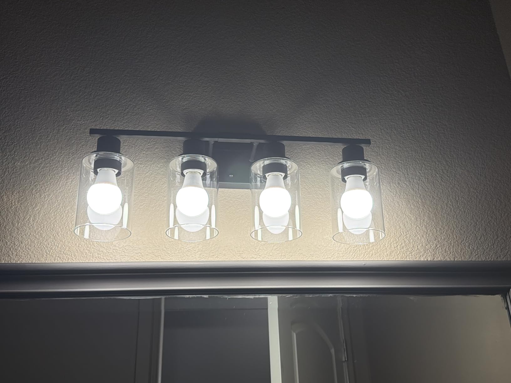 Indoi 4-Light Bathroom Light Fixtures, Matte Black Modern Vanity Lights with Clear Glass Shades, Bathroom Wall Lamp for Mirror Living Room Cabinet Bedroom Porch customer photo 2